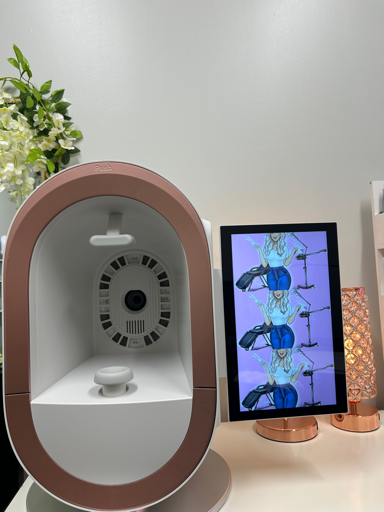 The studio's skin analyser booth beside a screen showing a client's scan results